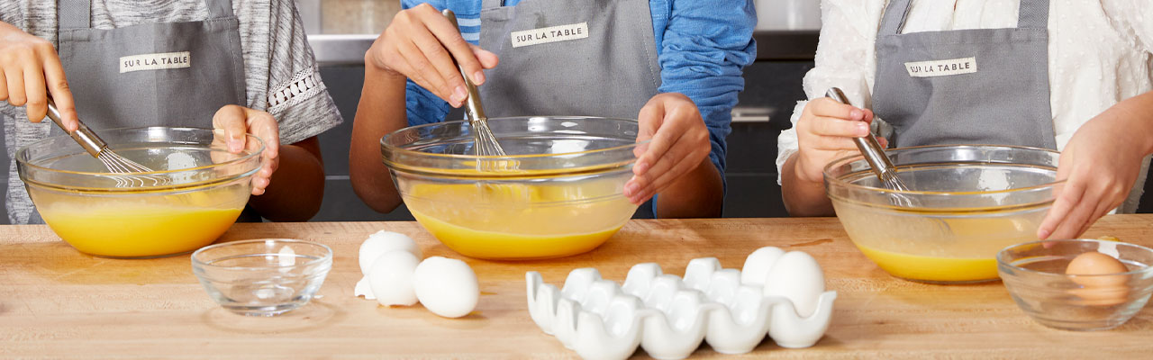 Learn More about Kids and Teens cooking classes kids cooking together in the kitchen