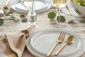 Modern Coupe dinnerware with gold flatware