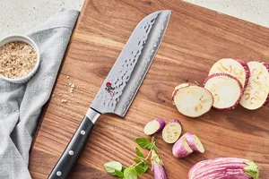 Miyabi Hisho chefs knife on cutting board