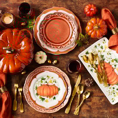 Pumpkin dinnerware and gold flatware