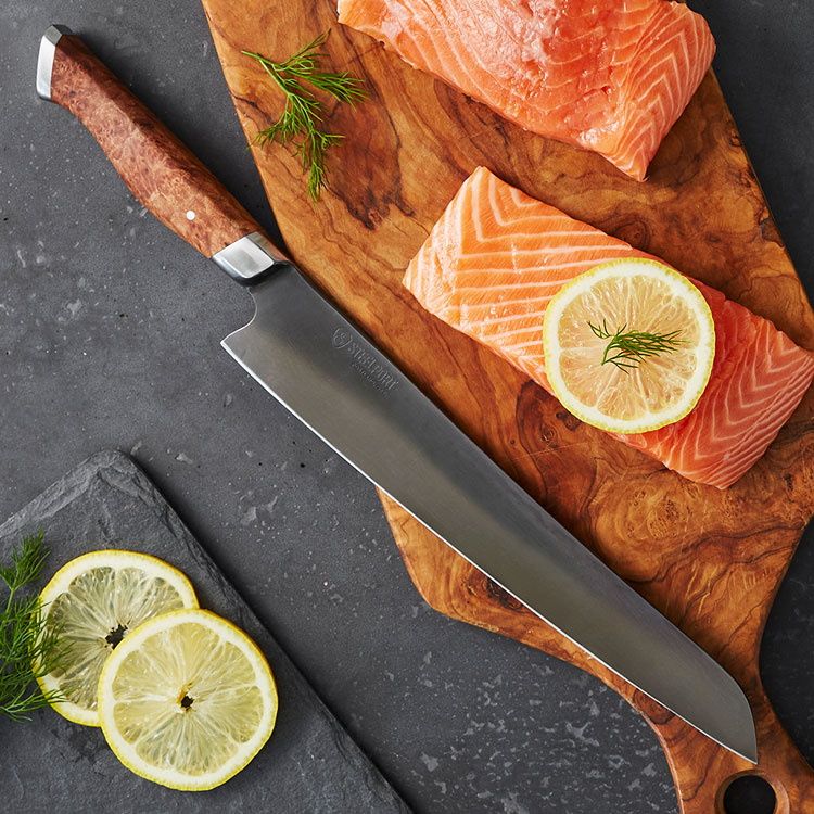 Steelport slicing knife on cutting board with salmon