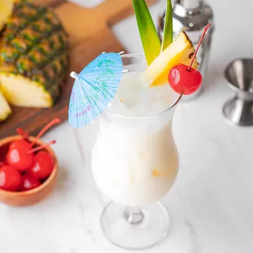 Piña Colada with fruit garnish