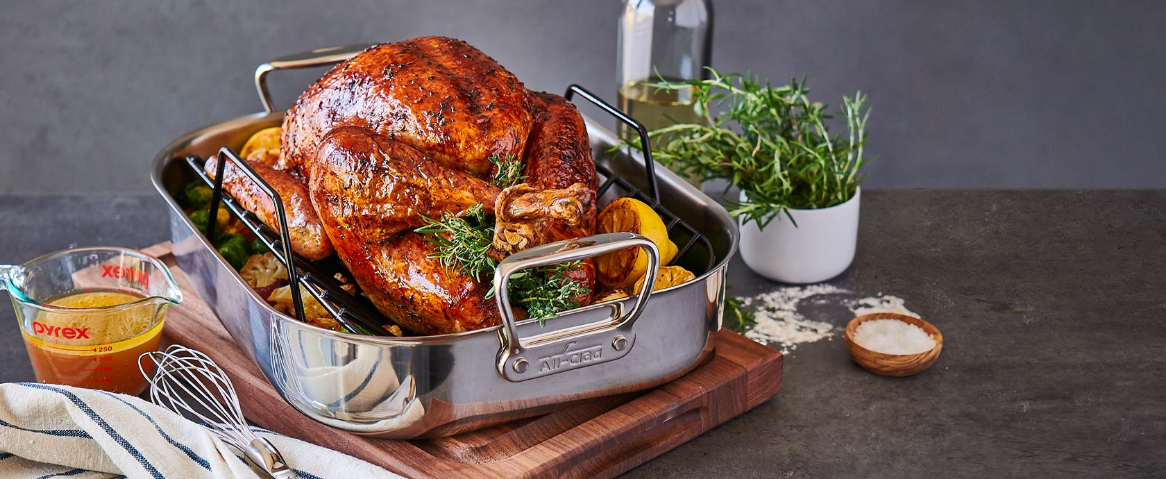 All-Clad roasting pan with roasted turkey