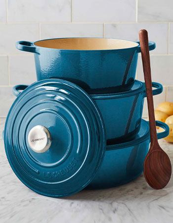 Le Creuset round wide ovens in deep teal color