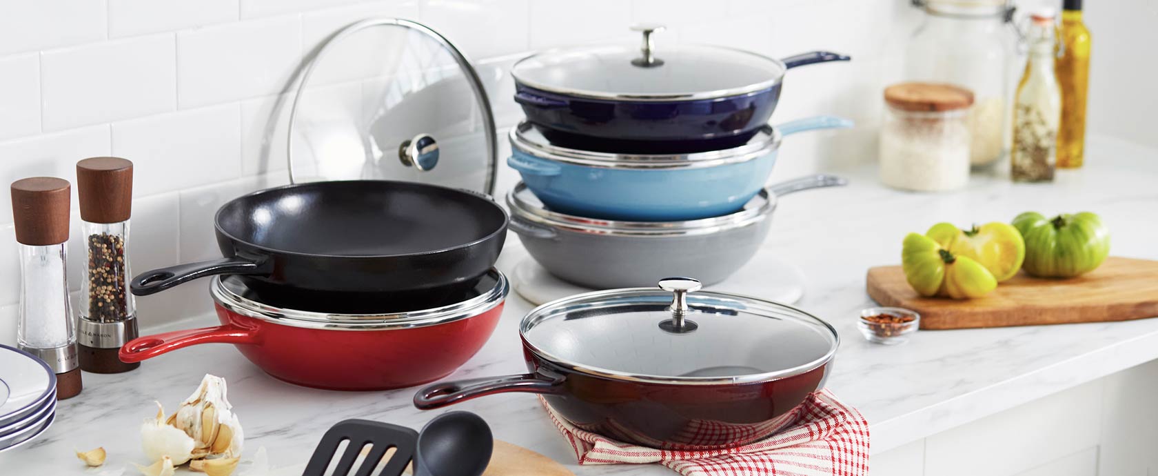 Staub Daily Pans stacked on kitchen counter