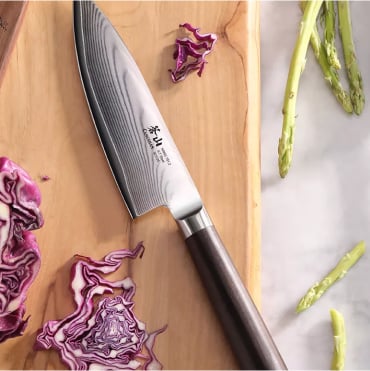 Cangshan Haku chef knife on cutting board