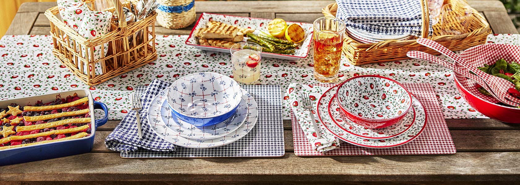Americana outdoor dinnerware in red and white strawberry design or blue and white floral
