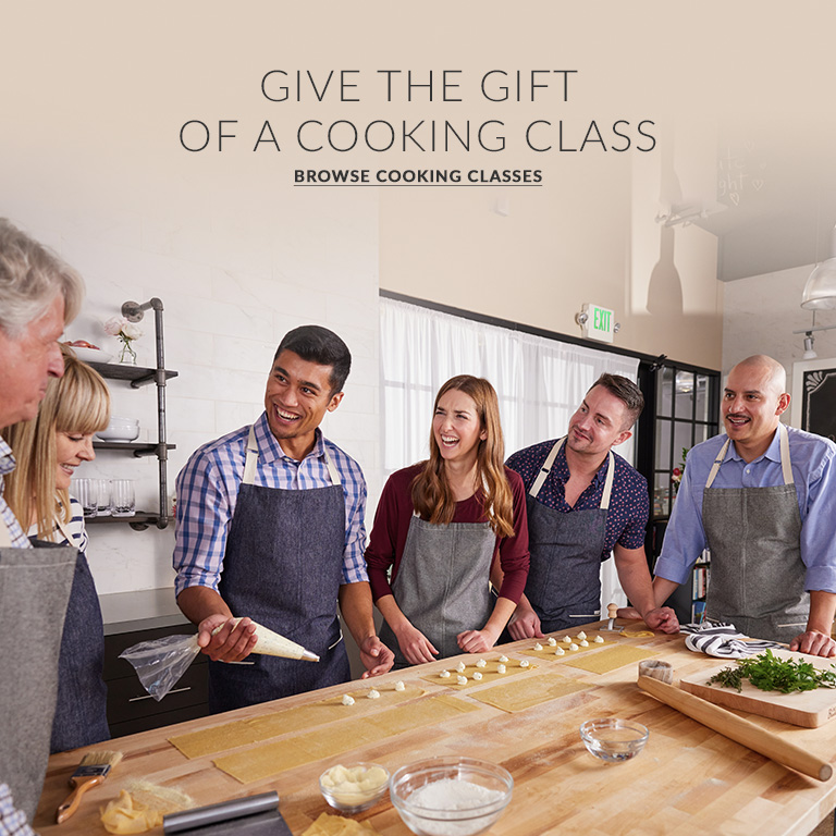 GIVE THE GIFT OF A COOKING CLASS. Browse classes. three couples at a Sur La Table cooking class making raviolis.