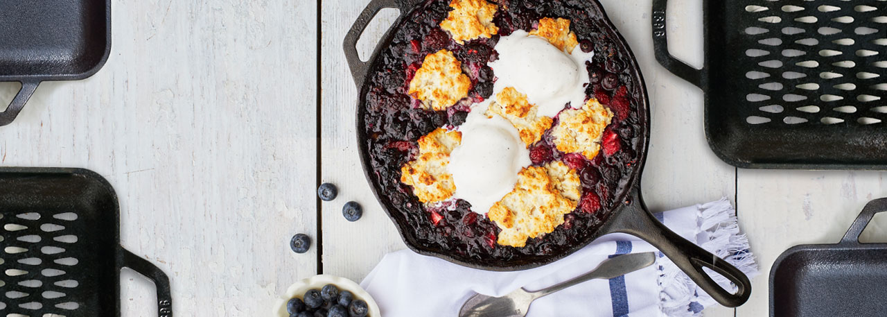 Lodge Cast Iron Skillet with mixed berry cobbler and vanilla ice cream