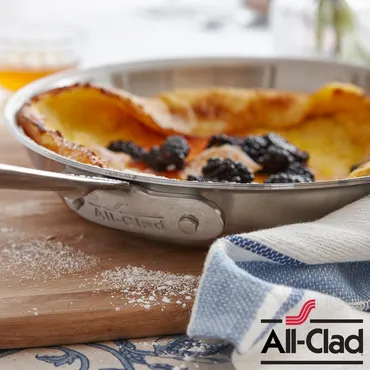 Skillet Soufflé Pancake with Lemon Syrup and Blackberries