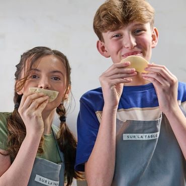 teen girl and boy making dumpling dough