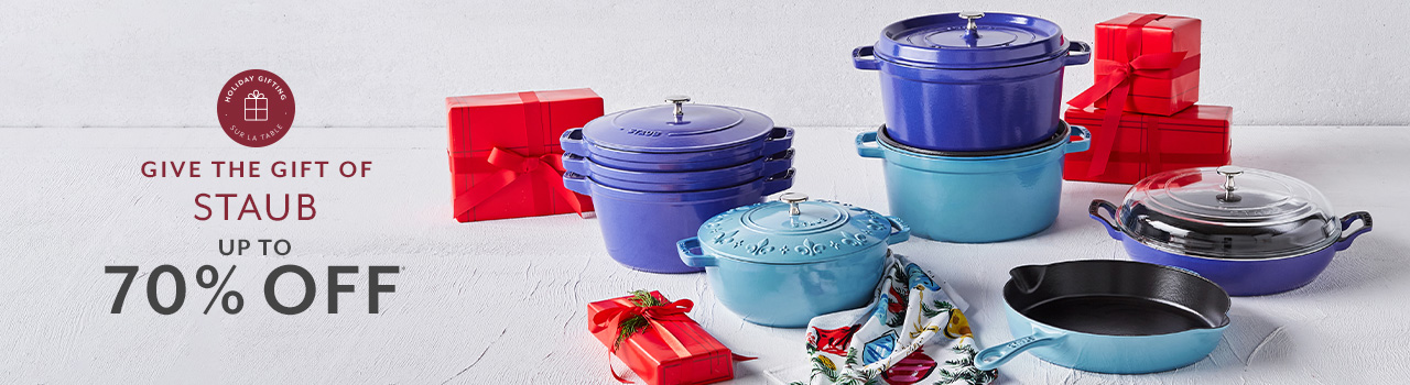 Give the gift of Staub up to 70% off. Staub stackable cast iron cookware and cocottes with red gift boxes.