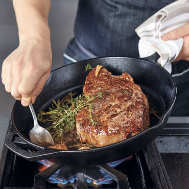Pepper-Crusted Steak in cast iron skillet
