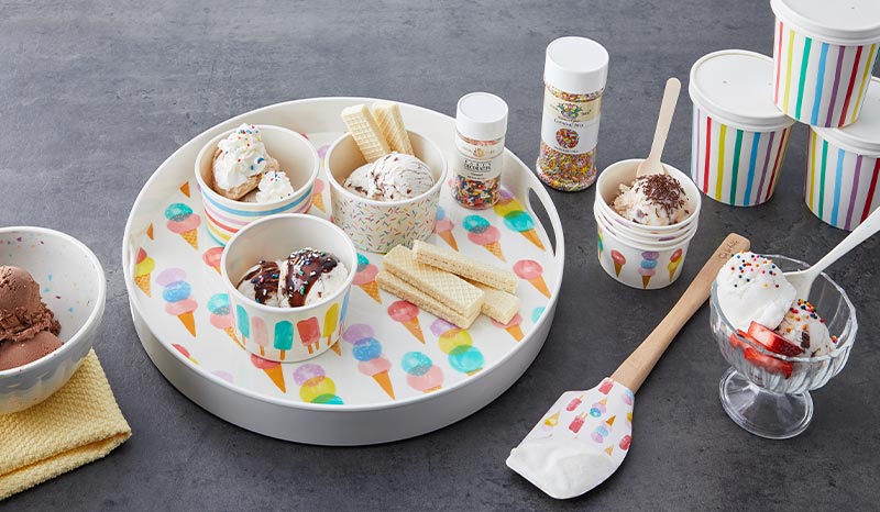 melamine tray and ice cream bowls with ice cream and sprinkles.