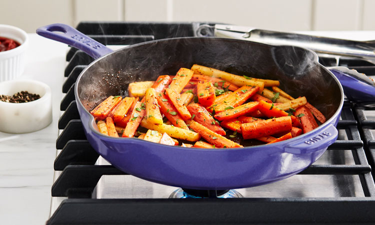 Staub skillet in blueberry color with carrots