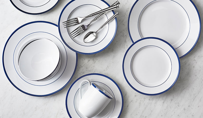 white dinnerware with blue border