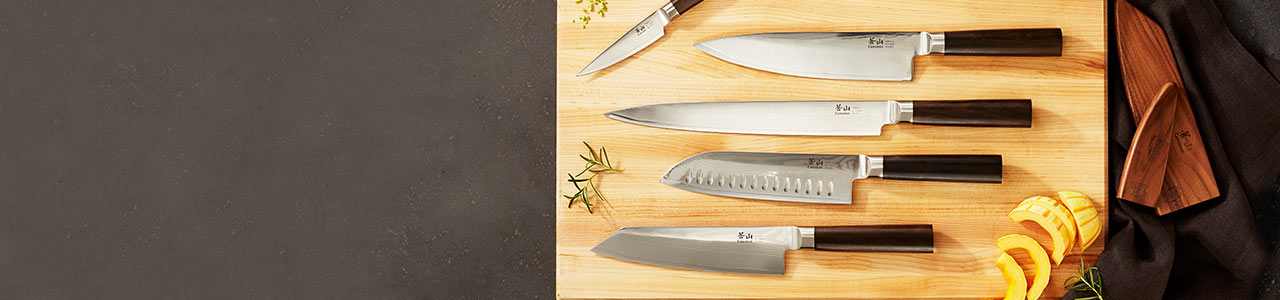 Cangshan knives on wooden cutting board
