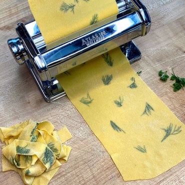 Fresh pasta sheet with herbs