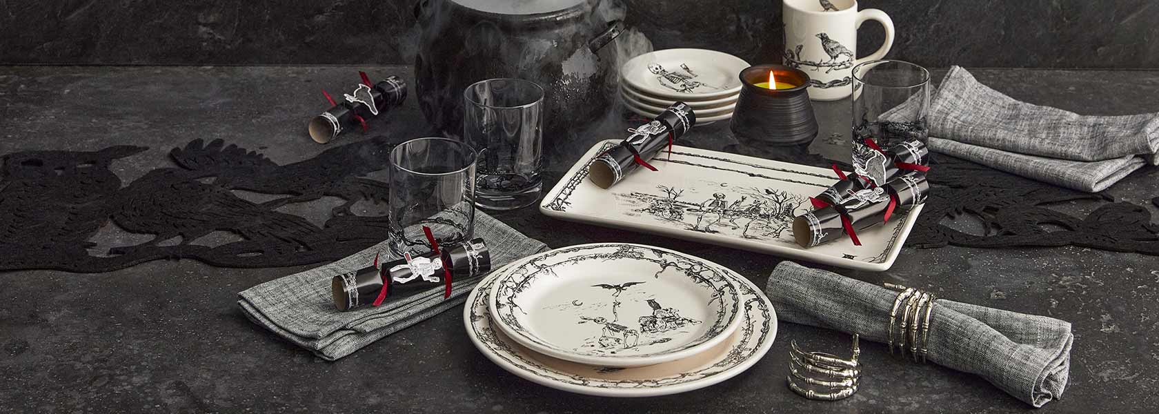 Halloween glassware and serveware with skeleton and bat motif