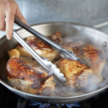 Chef pan roasting chicken