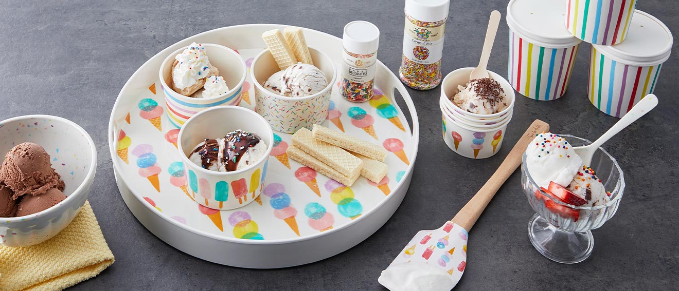 melamine tray and ice cream bowls with ice cream and sprinkles.