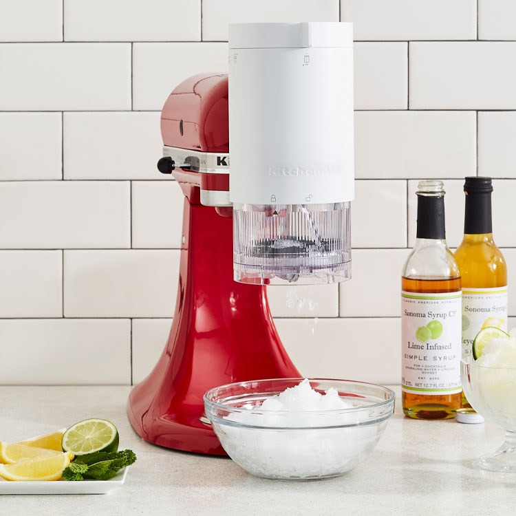 Red KitchenAid stand mixer with shave ice attachment