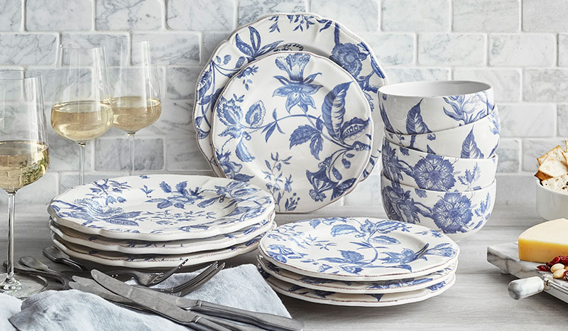 Blue floral design on cream-colored background of dinnerware