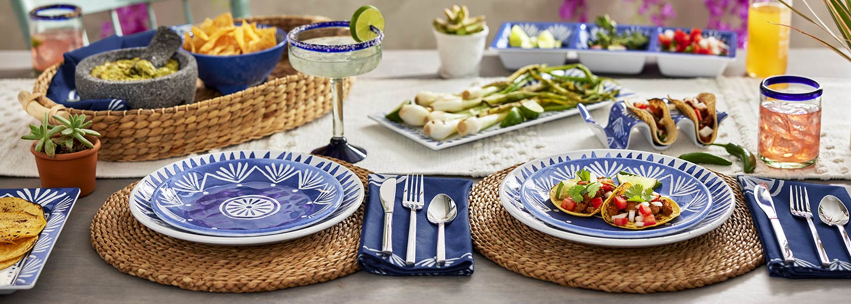 Blue and white El Mar outdoor dinnerware with tacos and margaritas