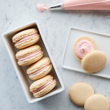 Almond Macaron with Raspberry Lemon Buttercream, White Macarons with pink filling