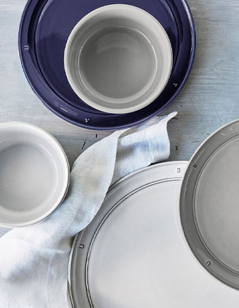 Staub dinnerware in blue, white and gray colors