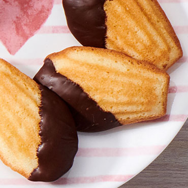 Classic French Madeleines dipped in chocolate