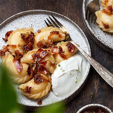 Mashed Potato Pierogi with Caramelized Onions and Sour Cream
