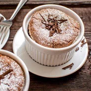 Chocolate Soufflé in white ramekin