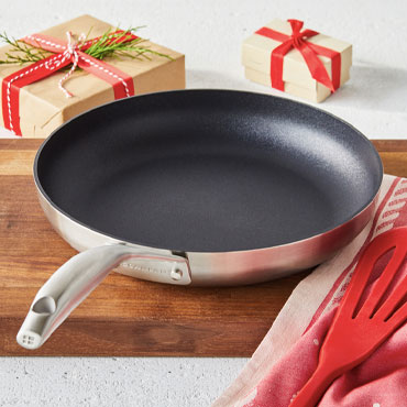 SCANPAN CS+ nonstick skillet with red spatula