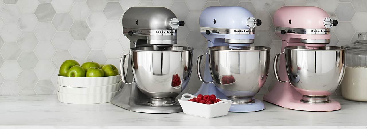 Kitchenaid stand mixers in silver, blue and pink