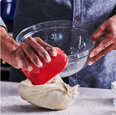 Chef with pastry bench scraper