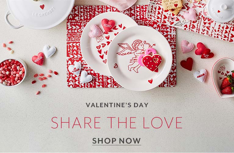 Share the love. Say Be Mine with Valentine's Day gifts from the Heart. Shop Now. White Le Creuset with red heart on lid.