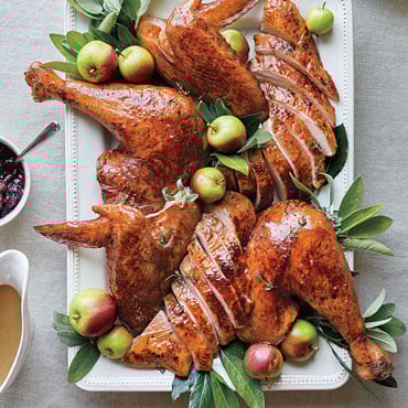 Roasted turkey sliced on white platter