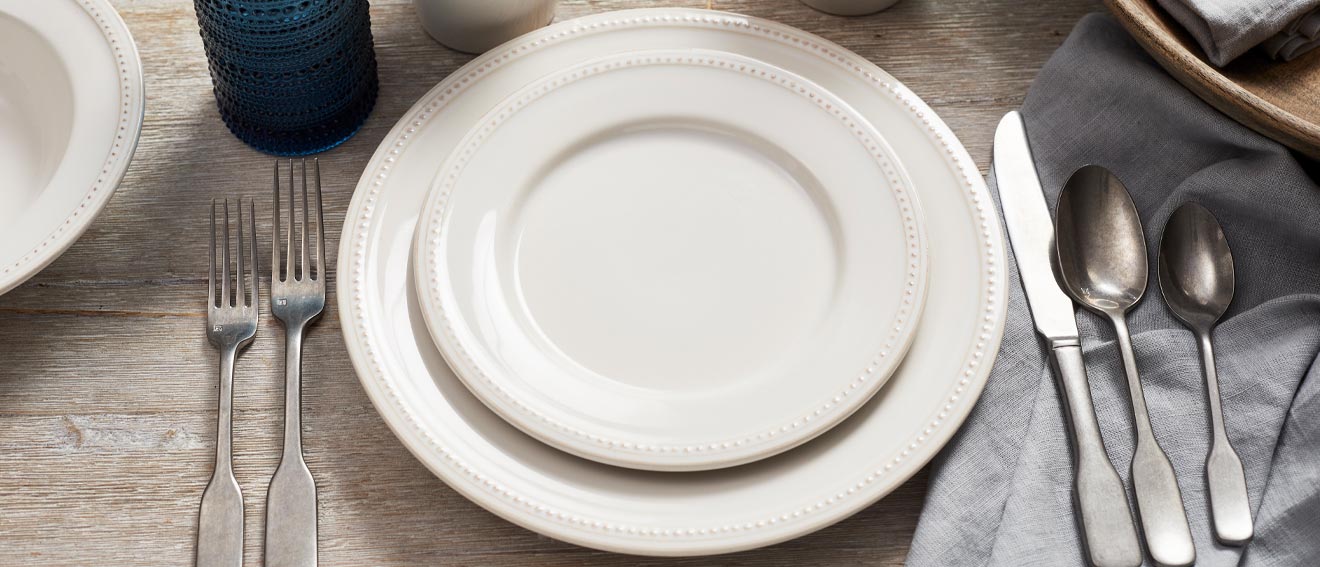 Pearl colored stoneware with distressed edges and raised-dot border