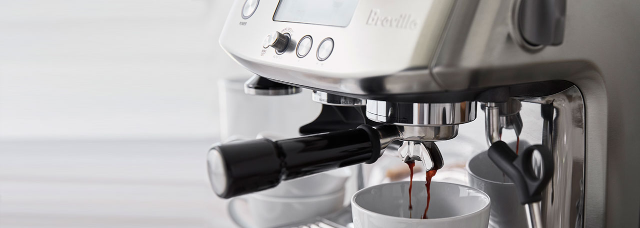 Breville coffee and espresso machine brewing espresso