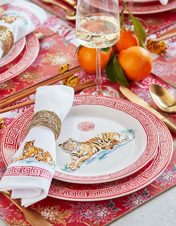 Tiger dinnerware and napkins with red border