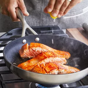 seared salmon fillets in skillet