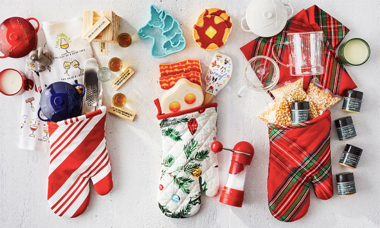 Small stocking stuffer gifts in oven mitts