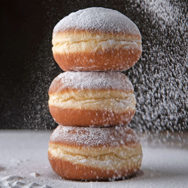 Classic Donuts dusted with powdered sugar