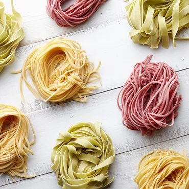 fresh colorful homemade pasta dough on counter