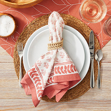 Napkins and table runner in coral and white