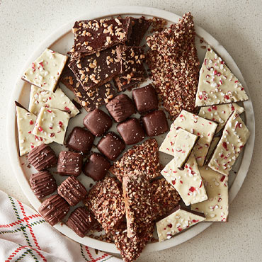 Holiday confections and peppermint bark on round platter