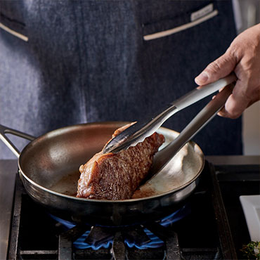 Strip Steak in skillet with Chianti Pan Sauce