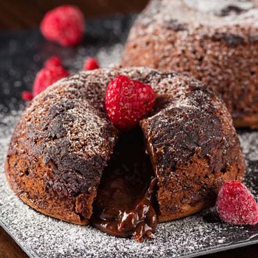 Chocolate Lovers Lava Cake with fresh raspberries