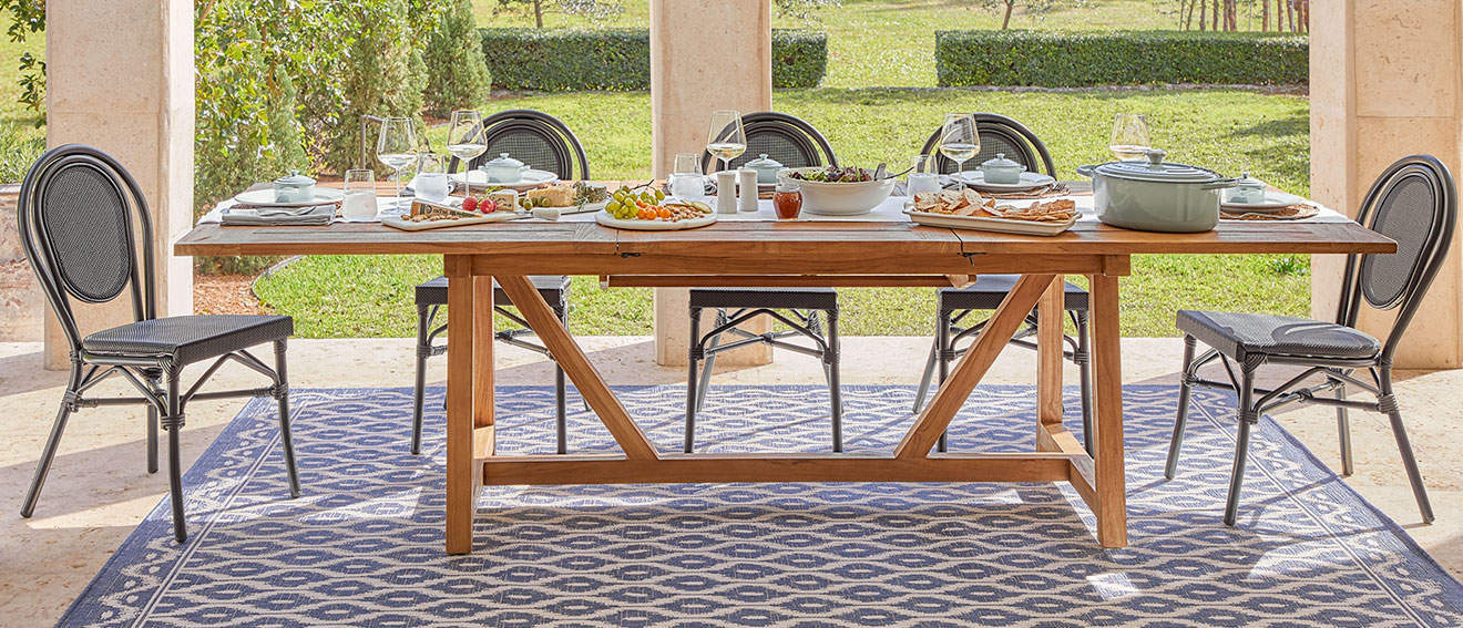 Fete teak dining table and woven rattan chairs